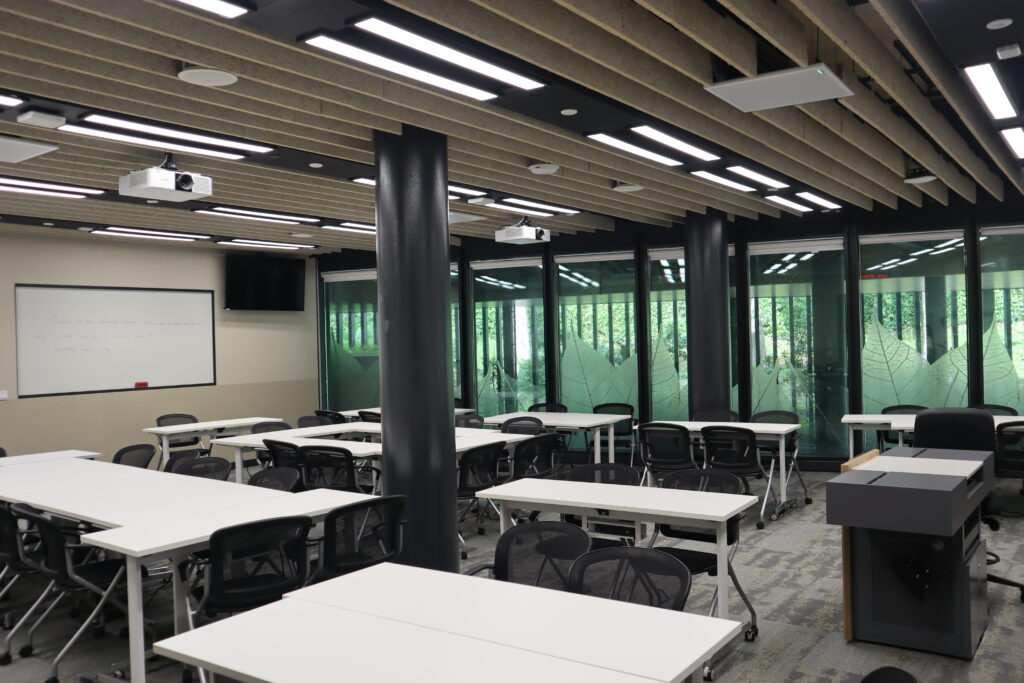 SMU classroom featuring projectors and ceiling microphones