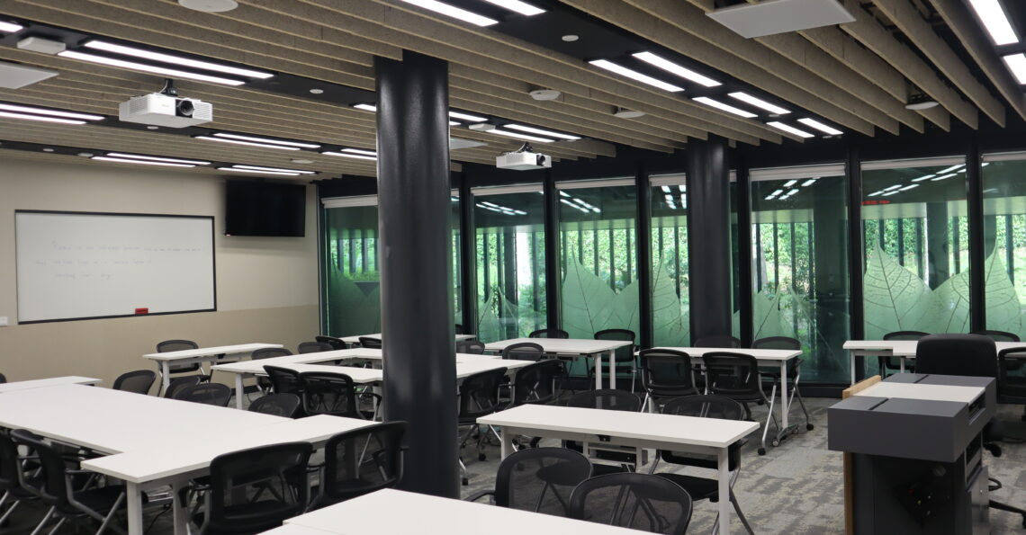 SMU classroom featuring projectors and ceiling microphones